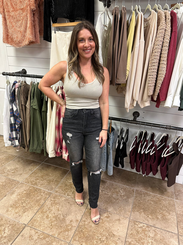 Get ready to rock that casual cool look in our Baylee Jeans by Risen! With high rise and distressed details, these relaxed fit skinny jeans scream effortless style. Perfect for any occasion, these jeans will be your new go-to for a playful, edgy look. Zipper and button closure. Front and back pockets. Fray bottoms.